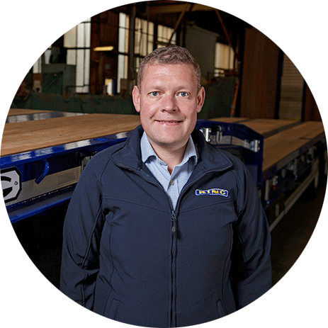 Dominik Sanders, Group Operations Director at King Trailers, with a trailer in the background.