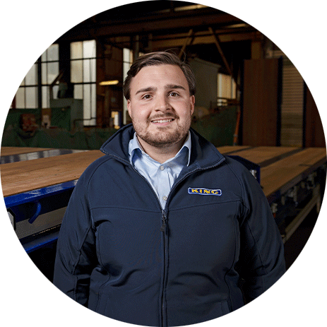 Charlie Styles, Group Head of Sales, King Trailers team member in factory setting.