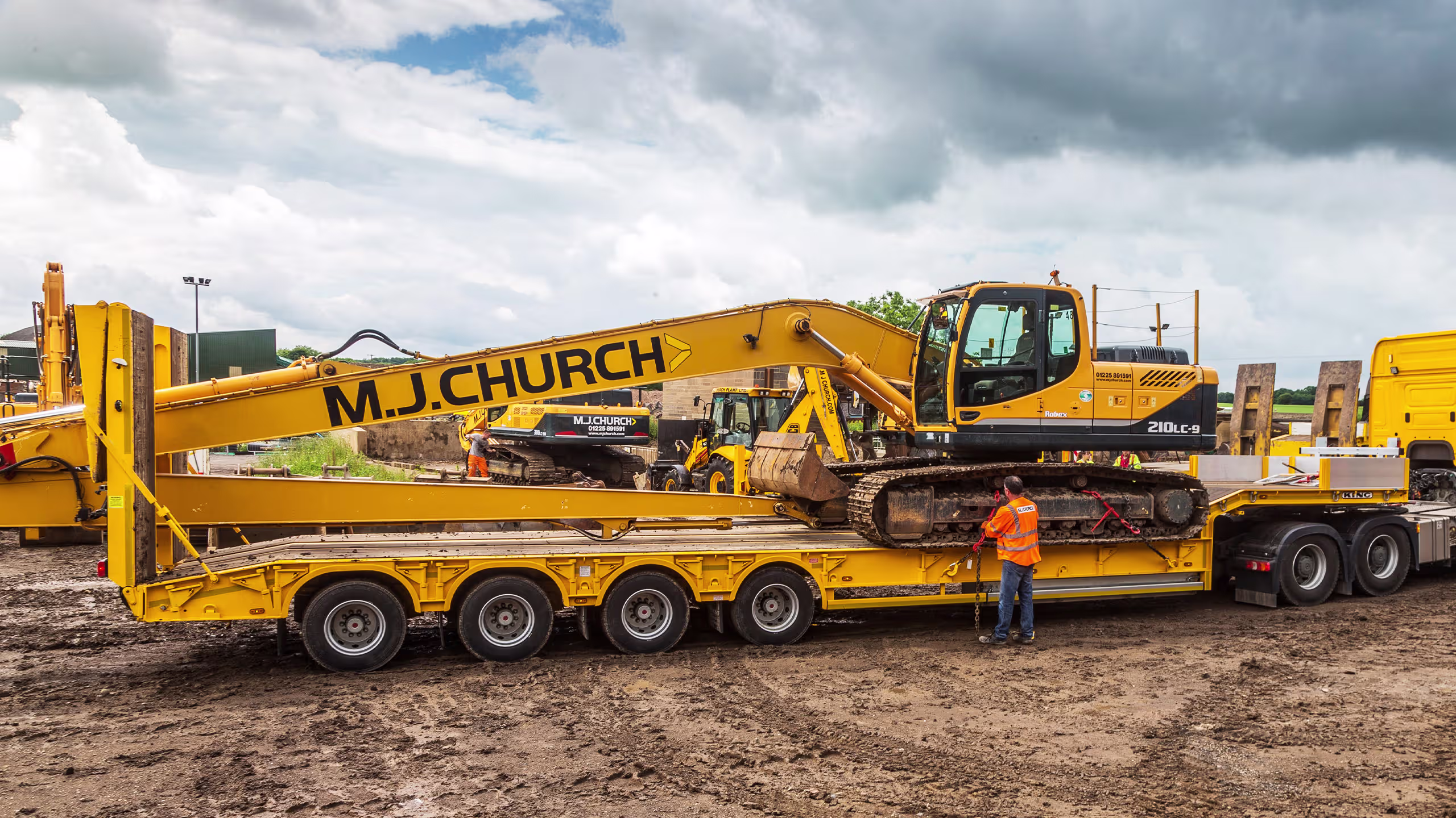 King GTS73 low loader trailer transporting a yellow excavator, STGO Category 2 heavy machinery transport.