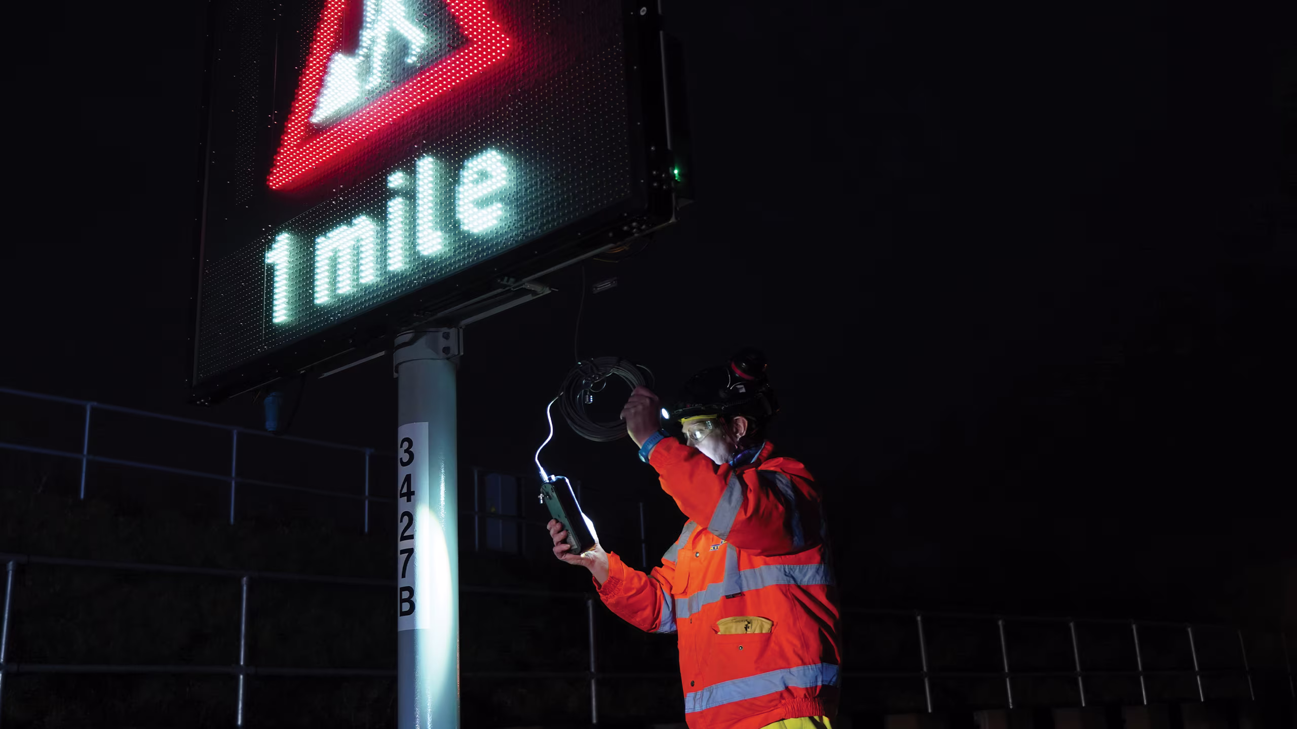 Highway traffic monitoring system with variable message sign and roadside worker
